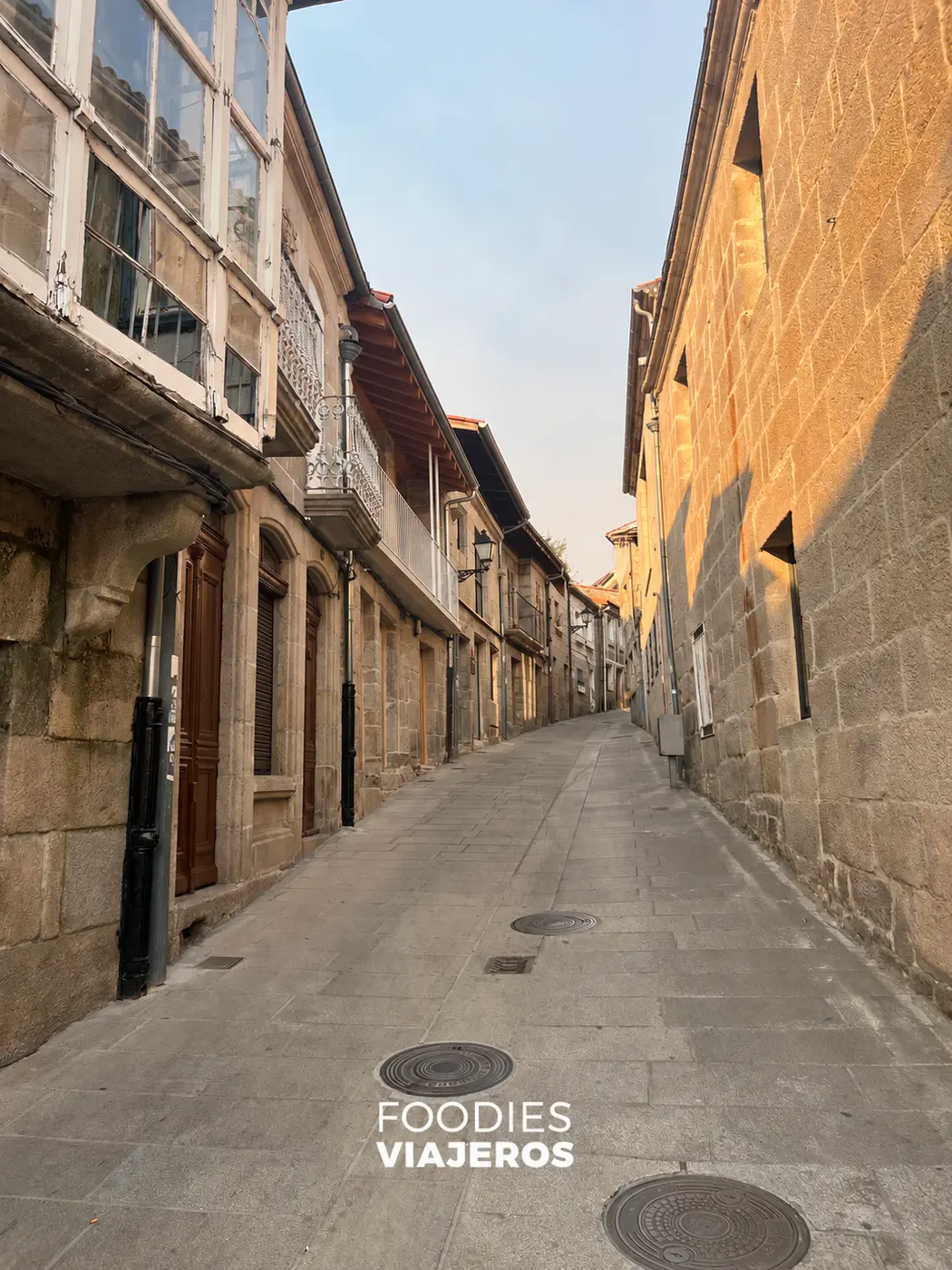 A cobblestone street in the historic district of Allariz